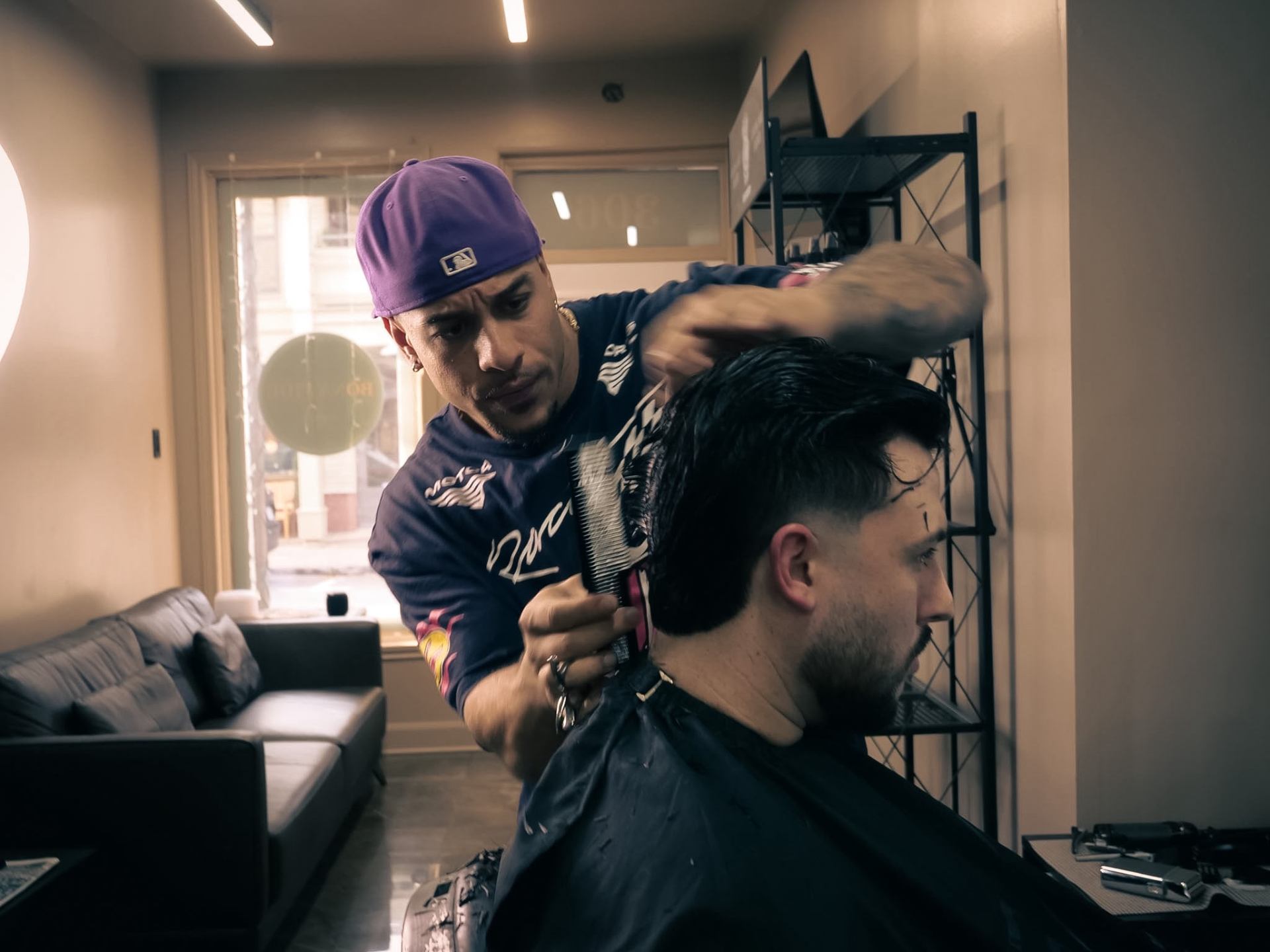 Barber combing and cutting in the chair